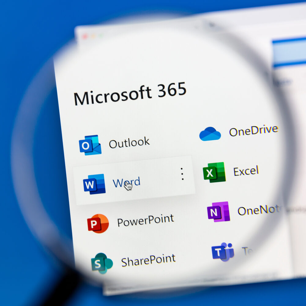Microsoft 365 apps viewed through a magnifying glass